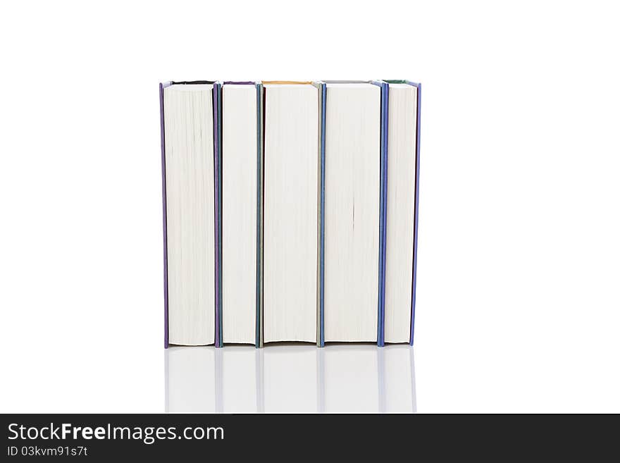 A group of books against a white background