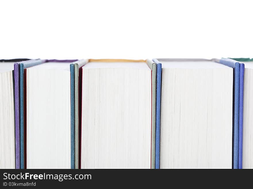 A group of books against a white background