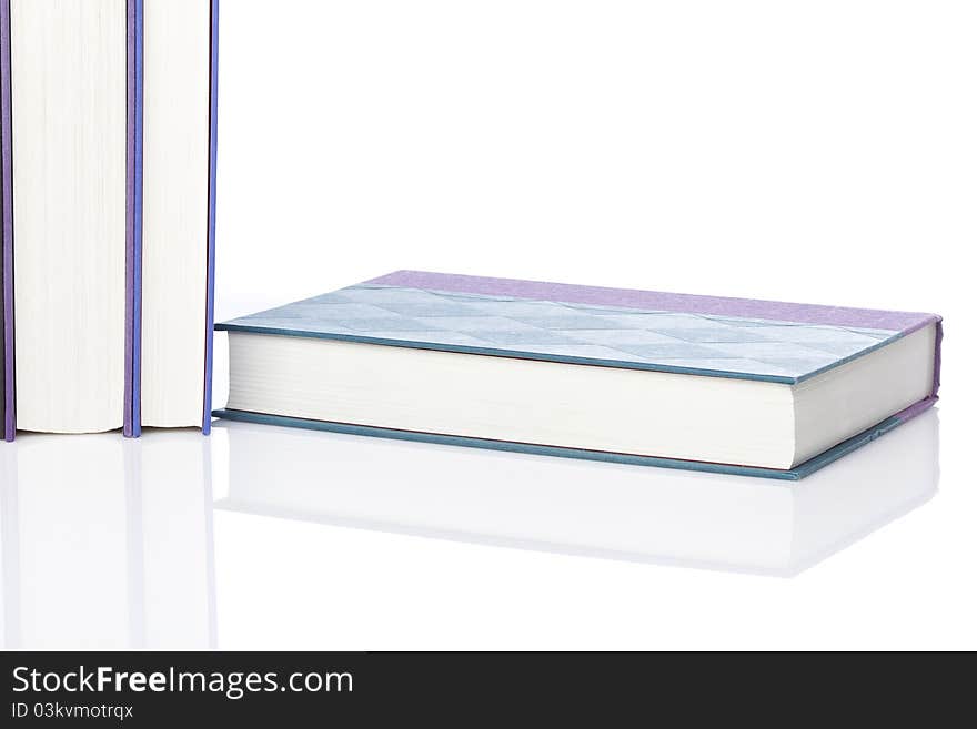 A group of books against a white background