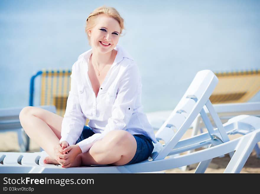 Beautiful Woman Sitting In Chaise