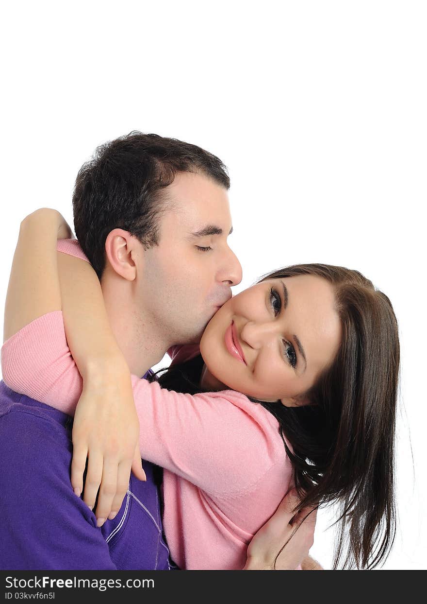 Sweet young couple in love kissing. isolated