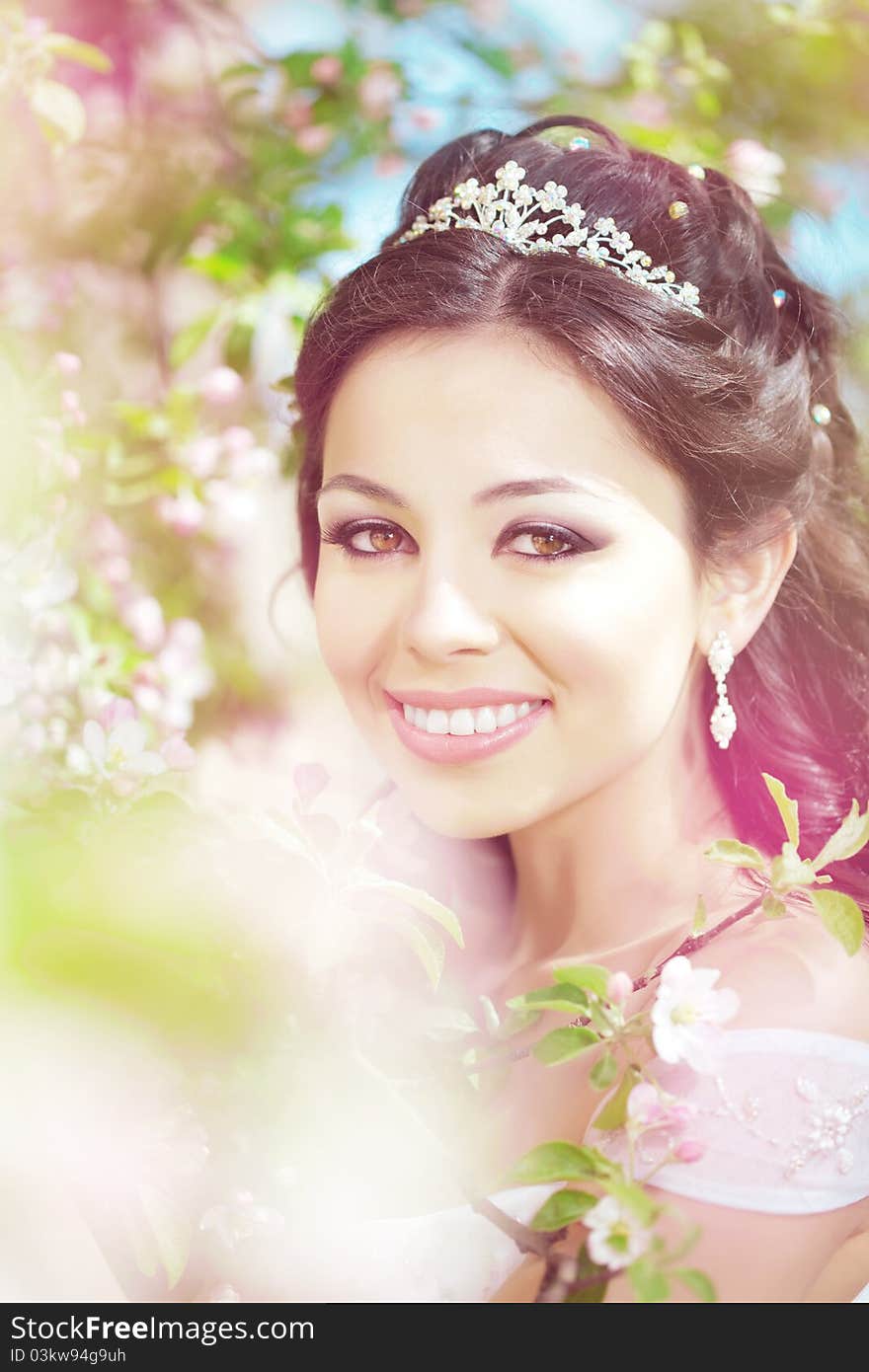 Beautiful bride in a blossoming garden