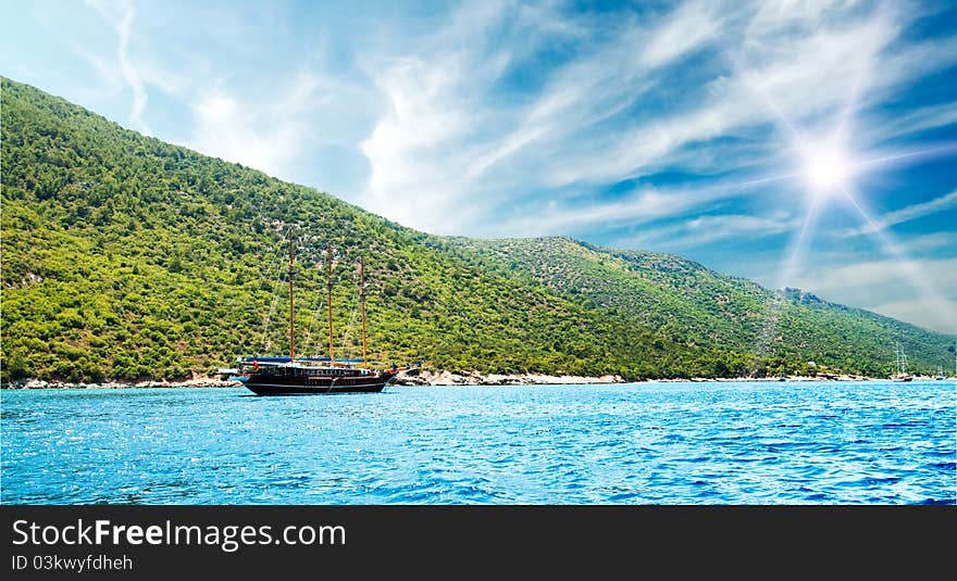 Bay in aegean sea and wooden yacht.