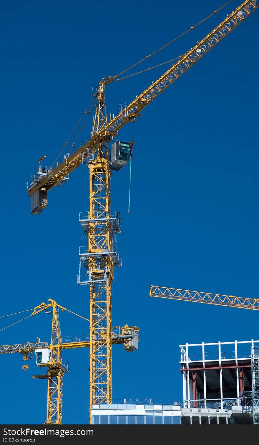 Lifting crane on building .Building technology. Lifting crane on building .Building technology.