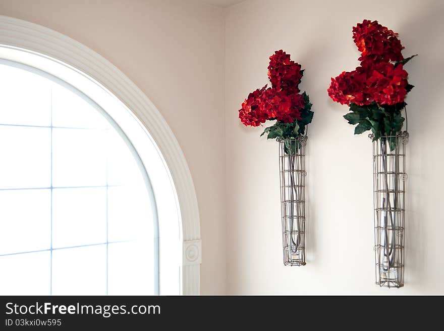 Red Flowers Beside Window