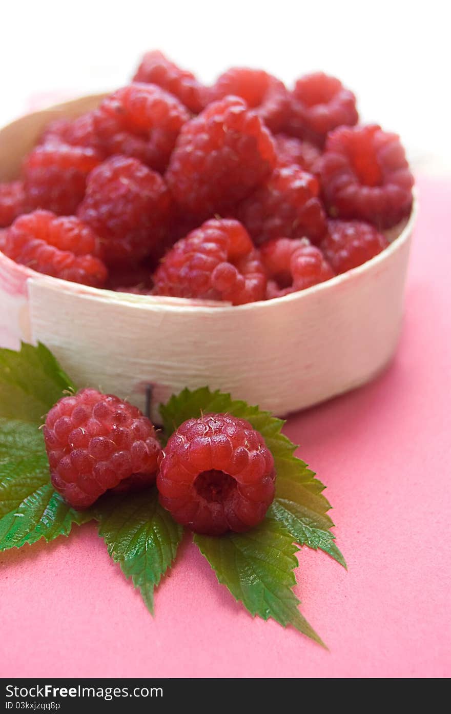 Raspberries In Wooden Basket