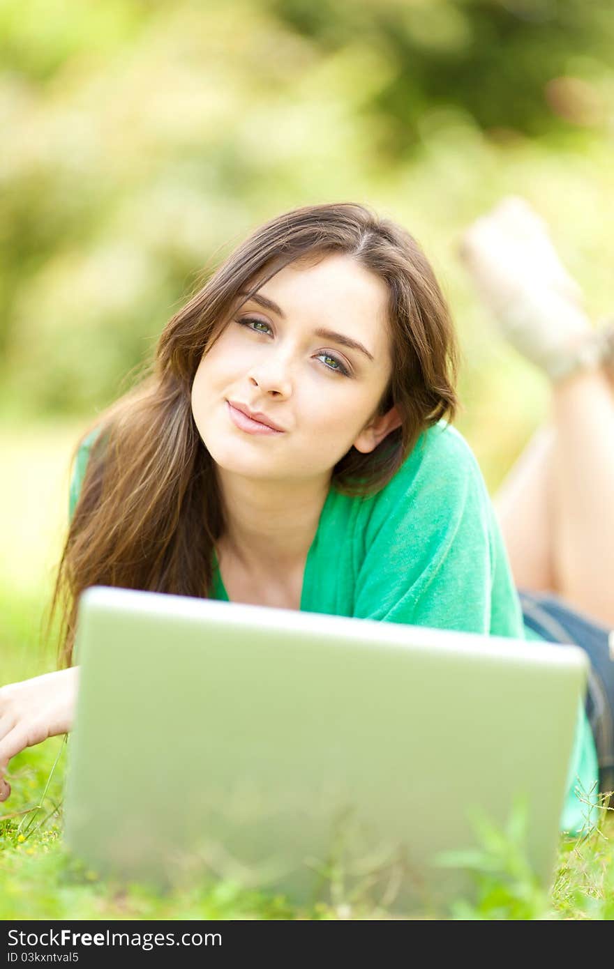 Young beautiful woman with a laptop