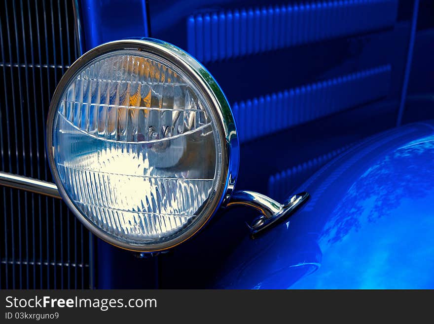 Detail of vintage American car's headlight. Detail of vintage American car's headlight