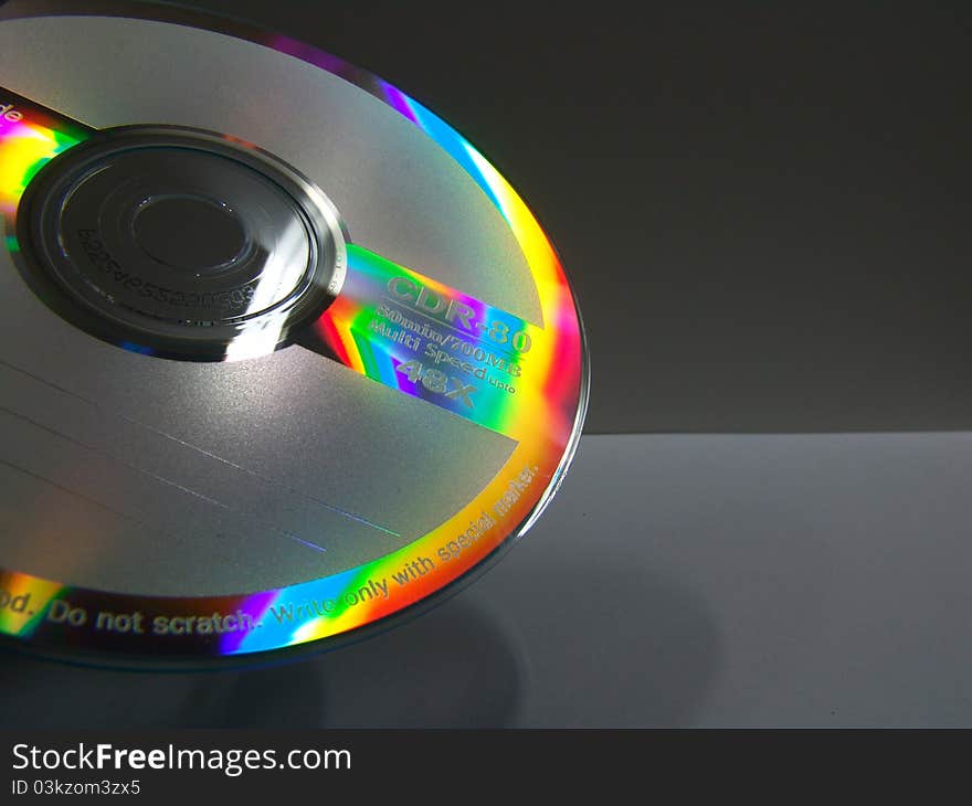 A shot of a cd with colorful reflections on it