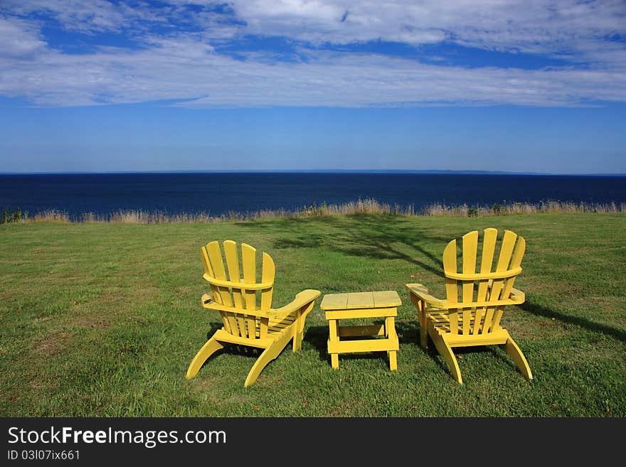 Adirondack chairs with ocean view