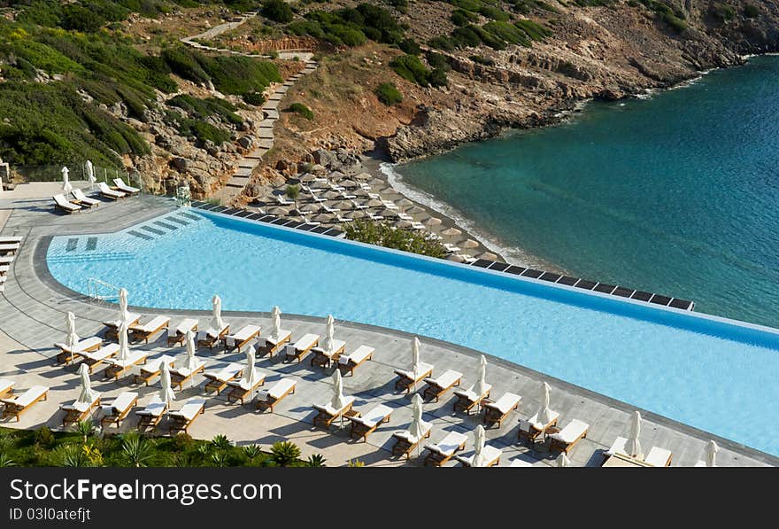 Empty luxury swimmig pool by morning. Crete. Greece