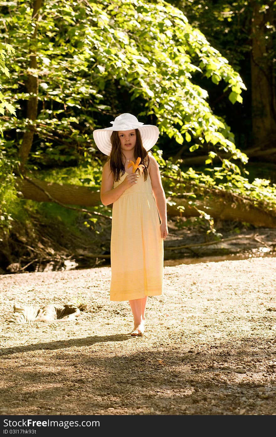 Picture of a young girl near a stream. Picture of a young girl near a stream