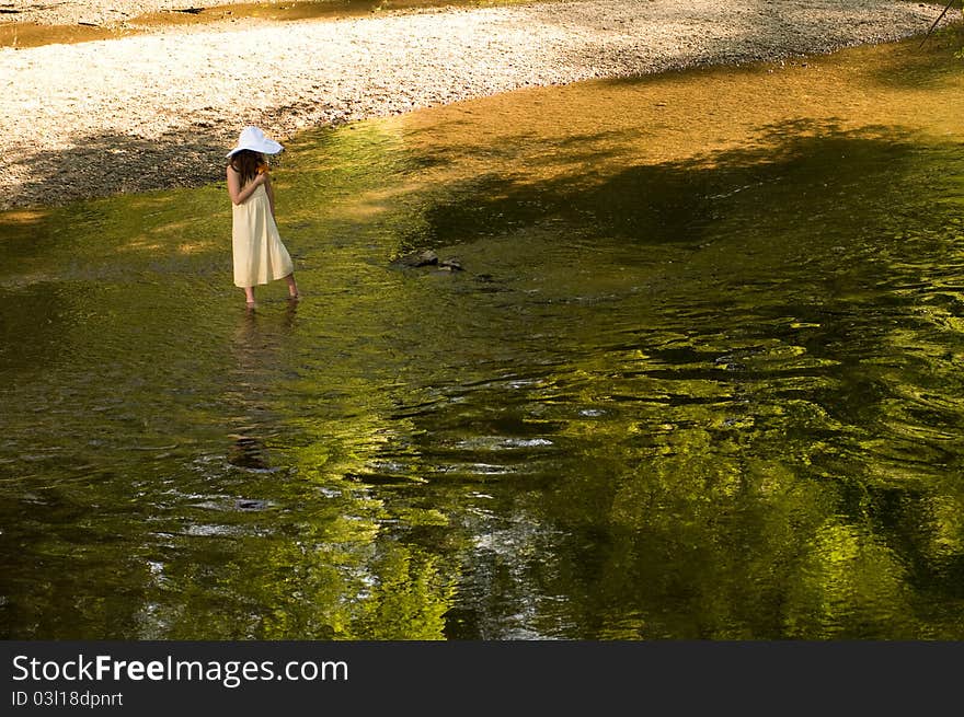 Picture of a young girl near a stream. Picture of a young girl near a stream