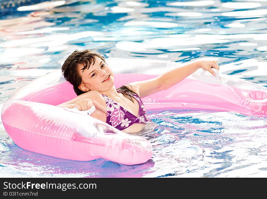 Picture of a young girl playing in a pool. Picture of a young girl playing in a pool