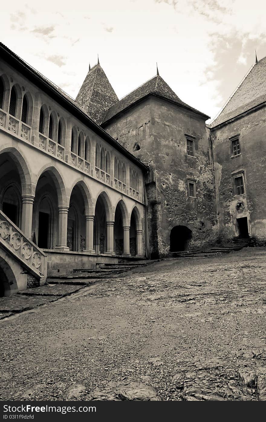 Black and white image of an old castle courtyard