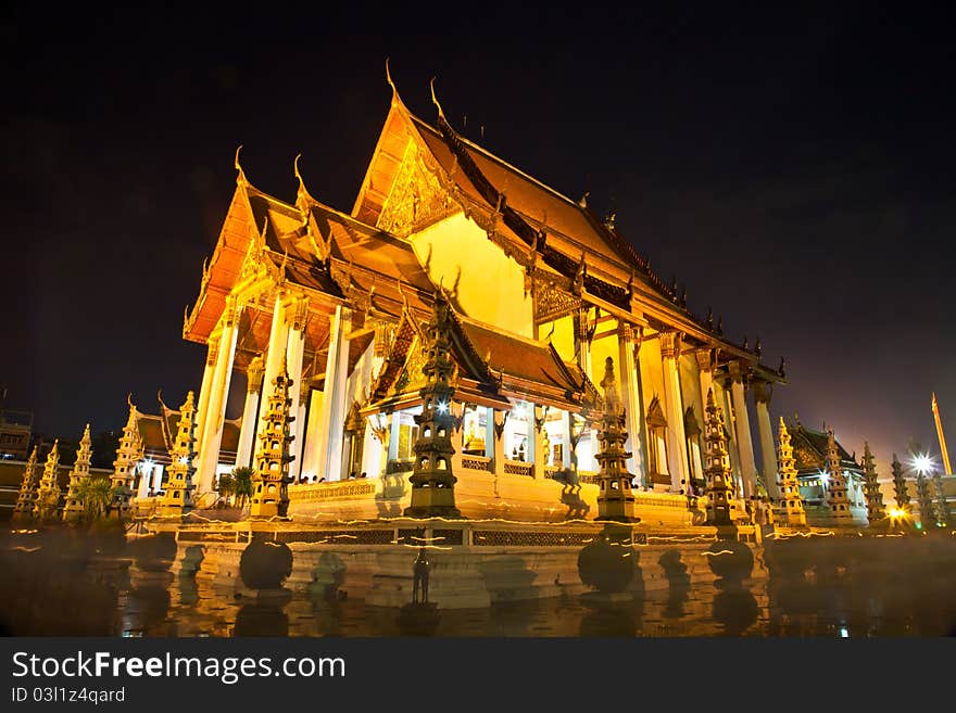 Wat Suthat is one of the oldest and largest temples in Bangkok, famed for its beautiful roofline, huge golden Buddha, magnificent frescoes and giant swing out front. This shot was taken in a night of a buddhist holiday,Wan Wisakha Bucha. Thousand of Buddhists were walking around the temple to pay their respect. Wat Suthat is one of the oldest and largest temples in Bangkok, famed for its beautiful roofline, huge golden Buddha, magnificent frescoes and giant swing out front. This shot was taken in a night of a buddhist holiday,Wan Wisakha Bucha. Thousand of Buddhists were walking around the temple to pay their respect.