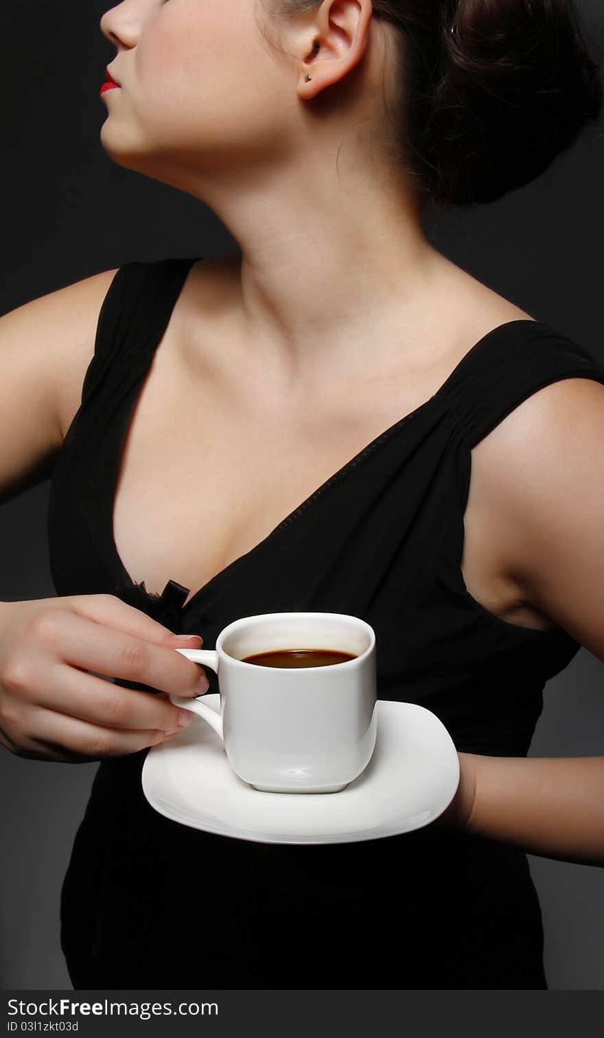 Woman with a cup of black coffee