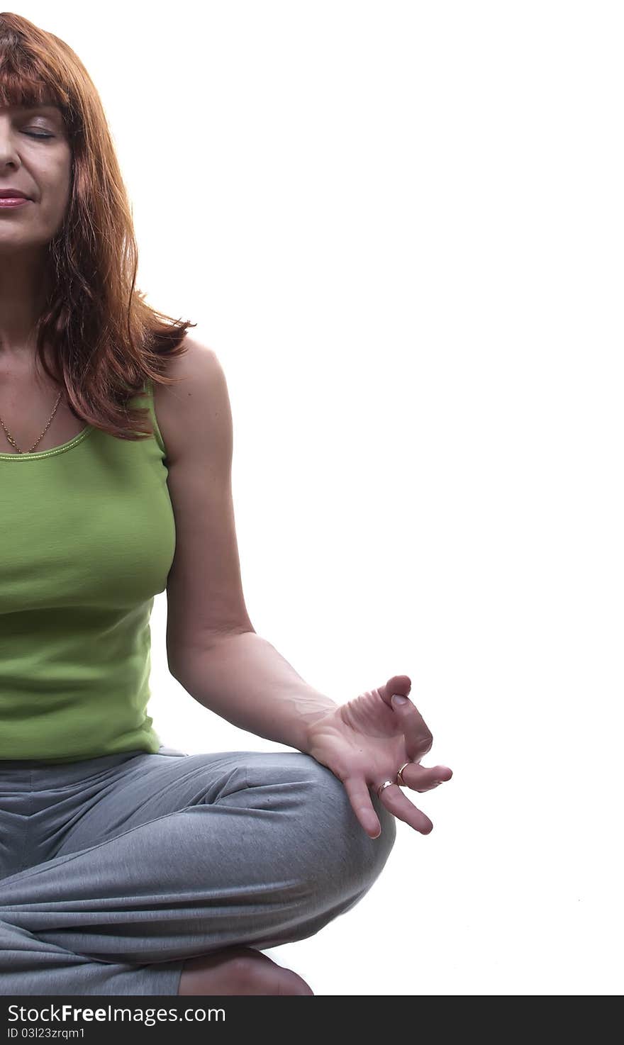 Redhead woman practicing yoga