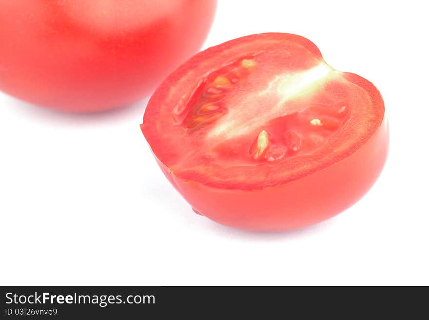 Red tomatoes isolated over white background.