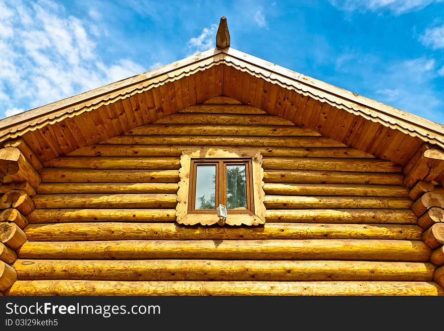 Felling of thick logs against the blue sky. Felling of thick logs against the blue sky