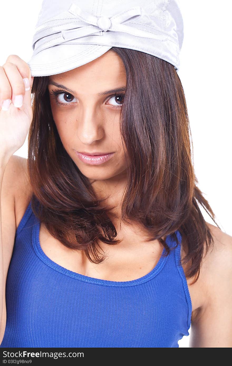 Beautiful woman wearing a silver hat and looking serious. Beautiful woman wearing a silver hat and looking serious