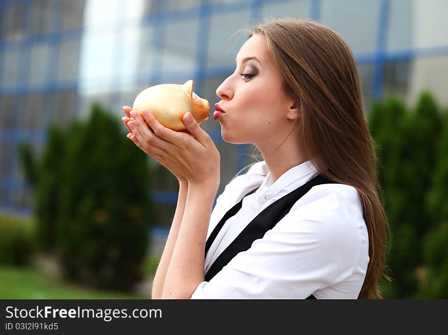 Businesswoman with moneybox