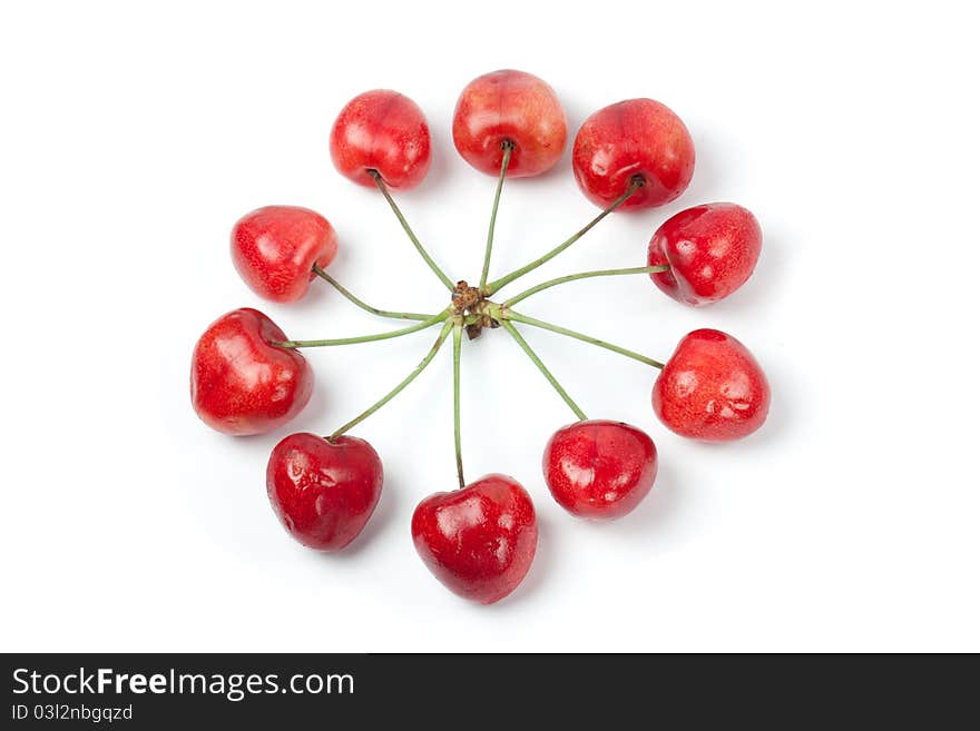 Sweet cherries in circle shape isolated on white background