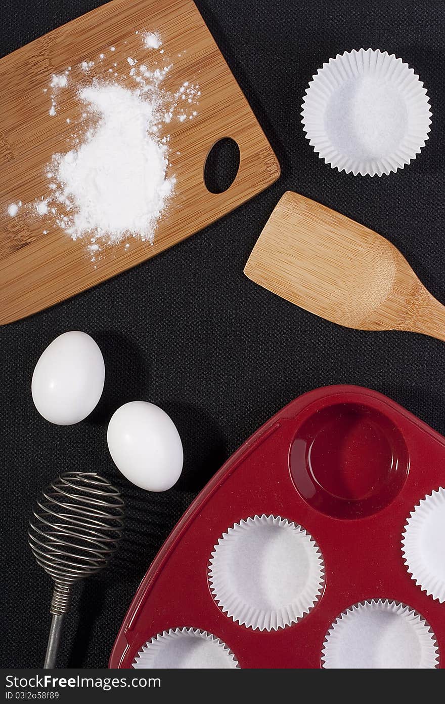 Silicone bakeware red with paper cups for baking.