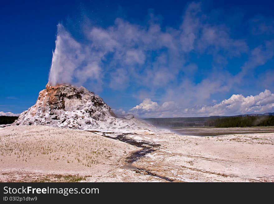 A geyser in Yellowstone Park erupting. A geyser in Yellowstone Park erupting.