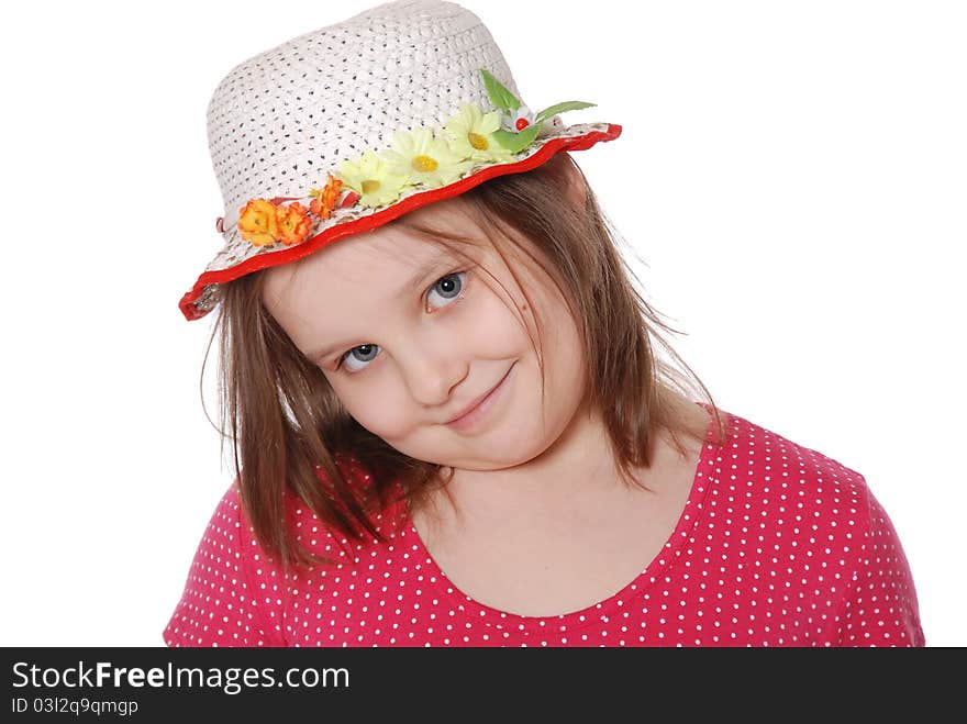 Portrait of little girl wearing a hat ans smiling isolated on white background