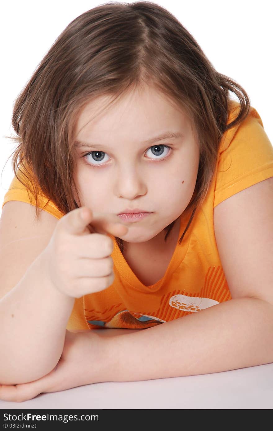 The little girl, points a finger isolated on white background