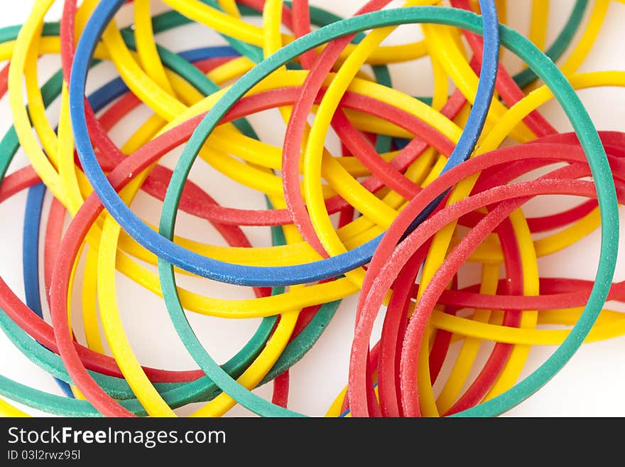 Colorful rubber bands against a white background