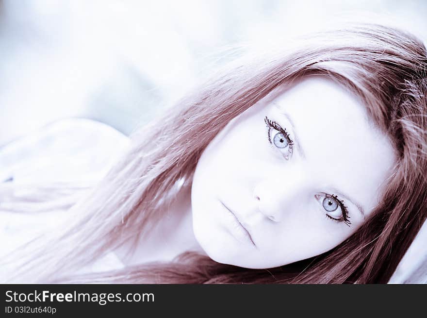 Portrait of beautiful young girl in high key