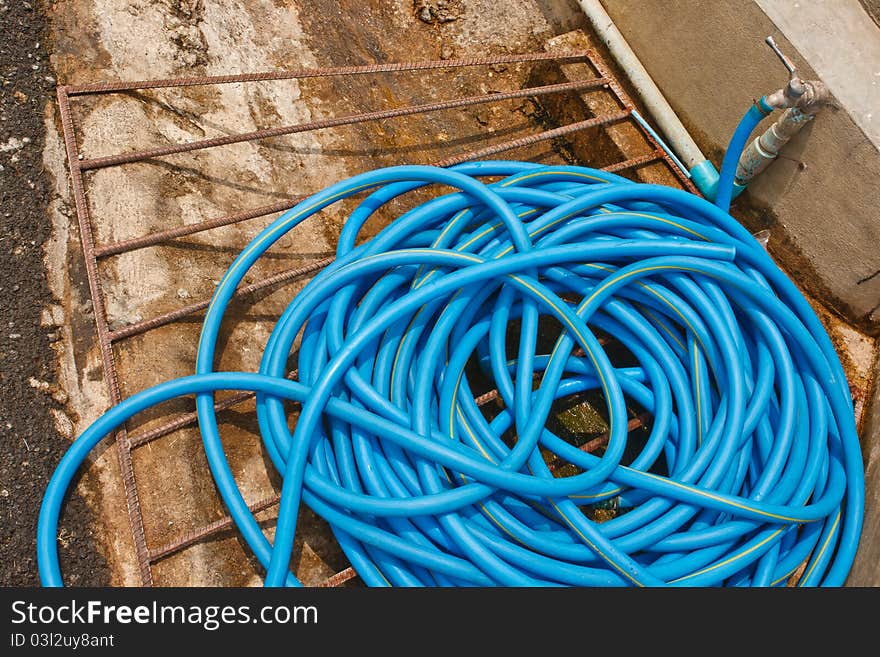 Hose coiled coil was placed in a trough along the corridor. Hose coiled coil was placed in a trough along the corridor