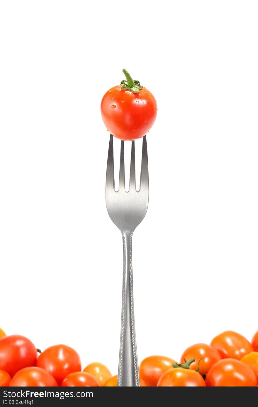 The fresh tomatoes with fork