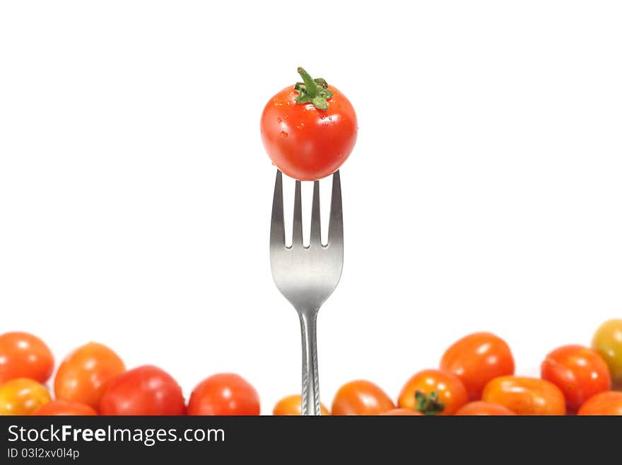 The fresh tomatoes isolated on white background