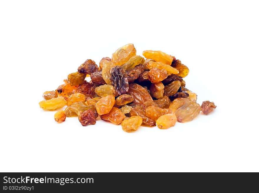 Close up shot of a pile of raisins on a white background