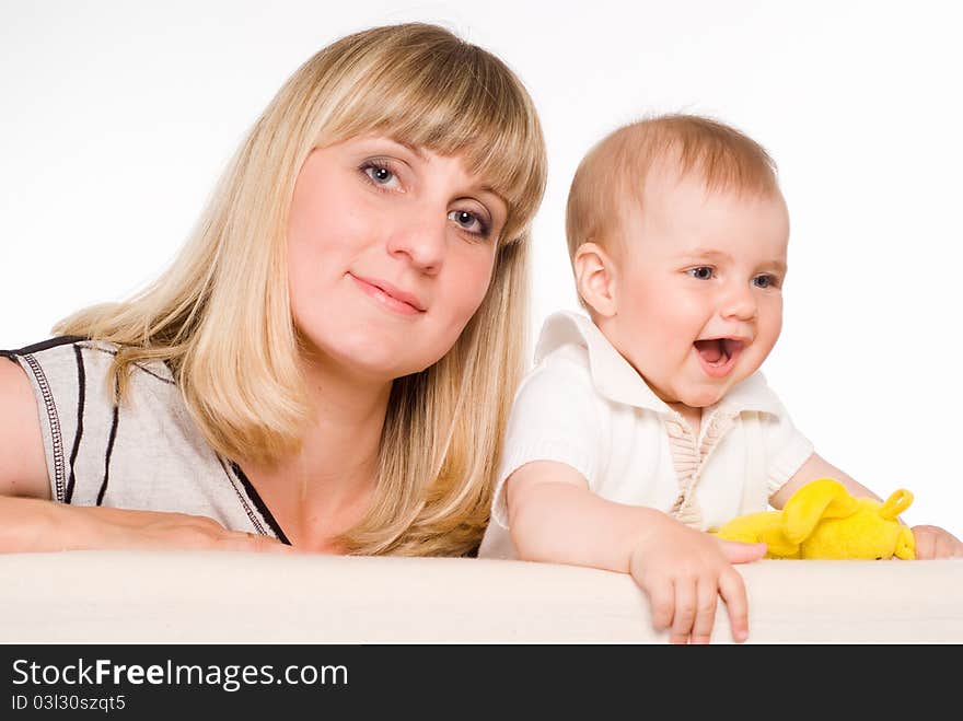 Mom playing with her son on a white. Mom playing with her son on a white