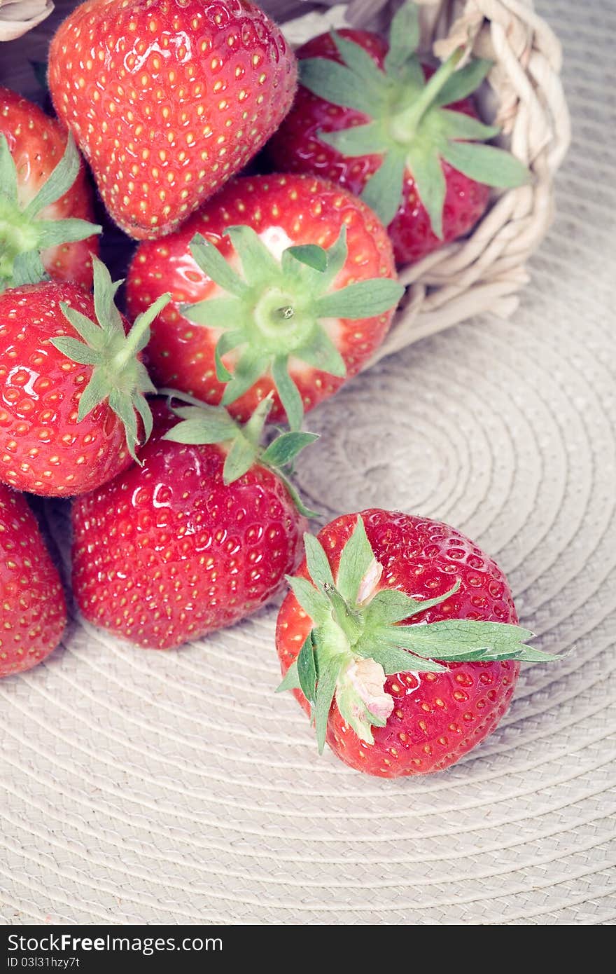 Heap of fresh strawberries in a basket, closeup shot