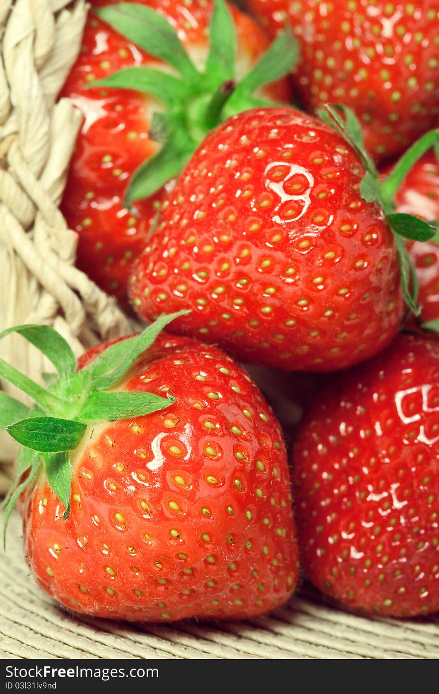 Fresh strawberries in a basket, closeup shot