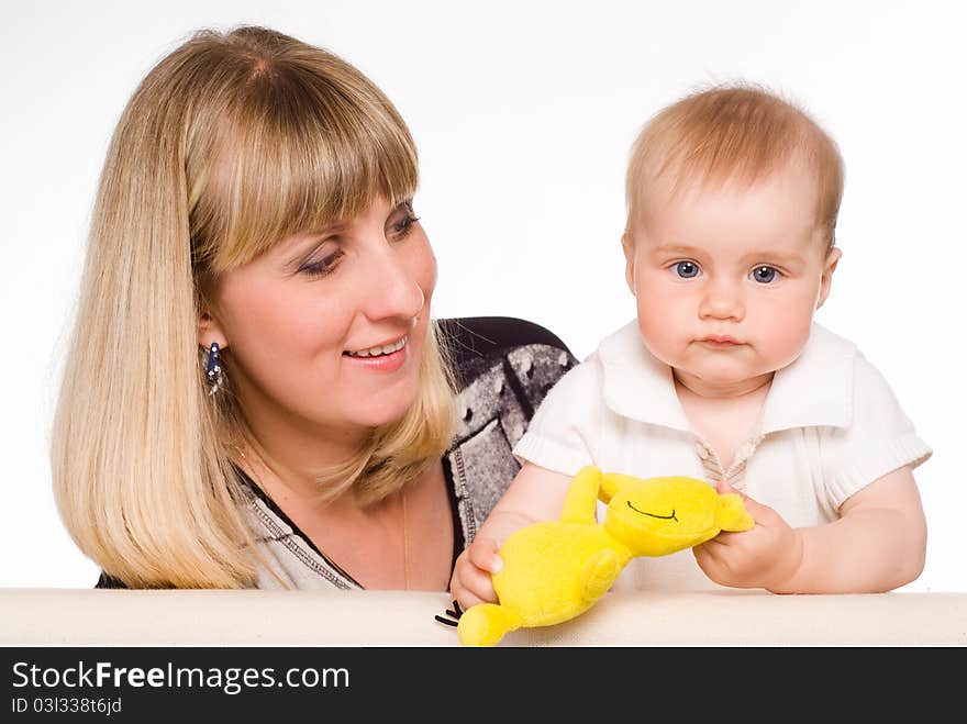 Mom playing with her son on a white. Mom playing with her son on a white