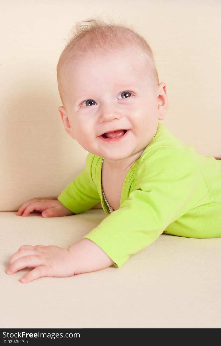 Baby Lying On Sofa