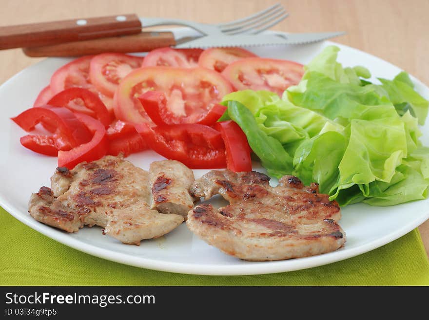 Fried pork with salad