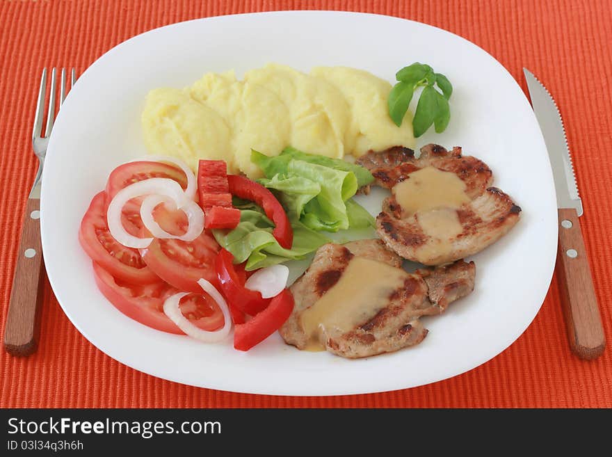 Fried pork with sauce and potato