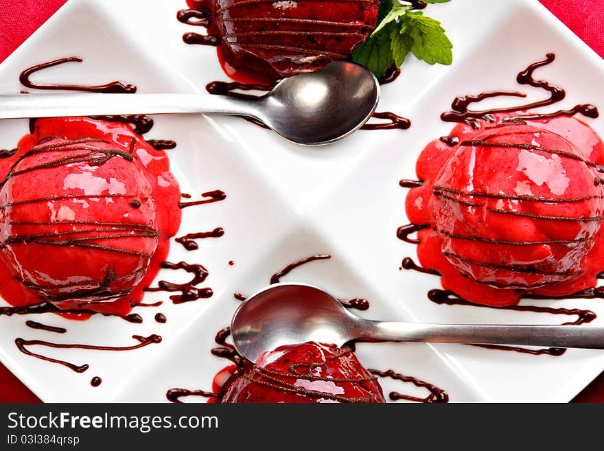 Berry fruit ice cream served on the white plate