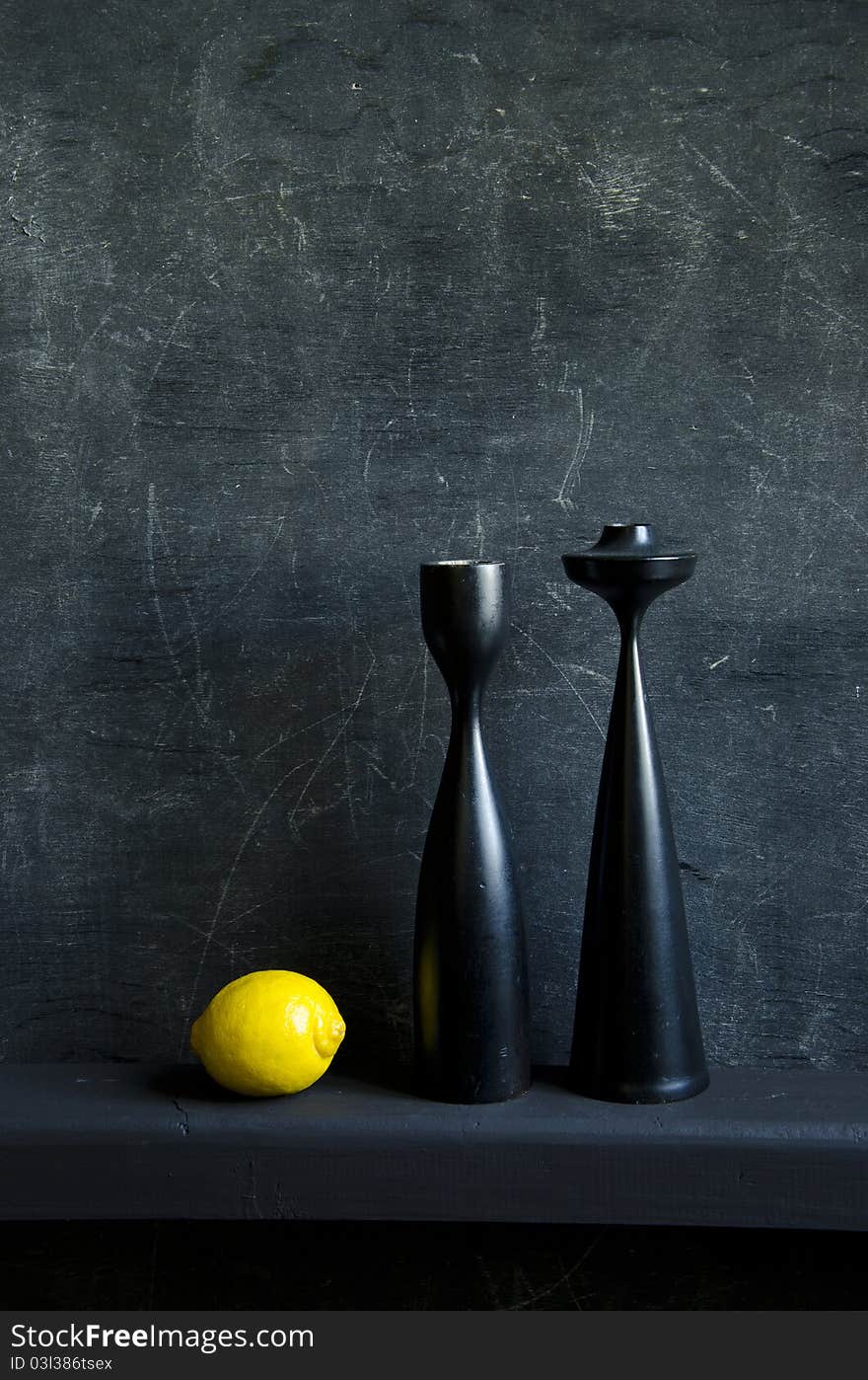 Black still-life with one yellow lemon. Black still-life with one yellow lemon