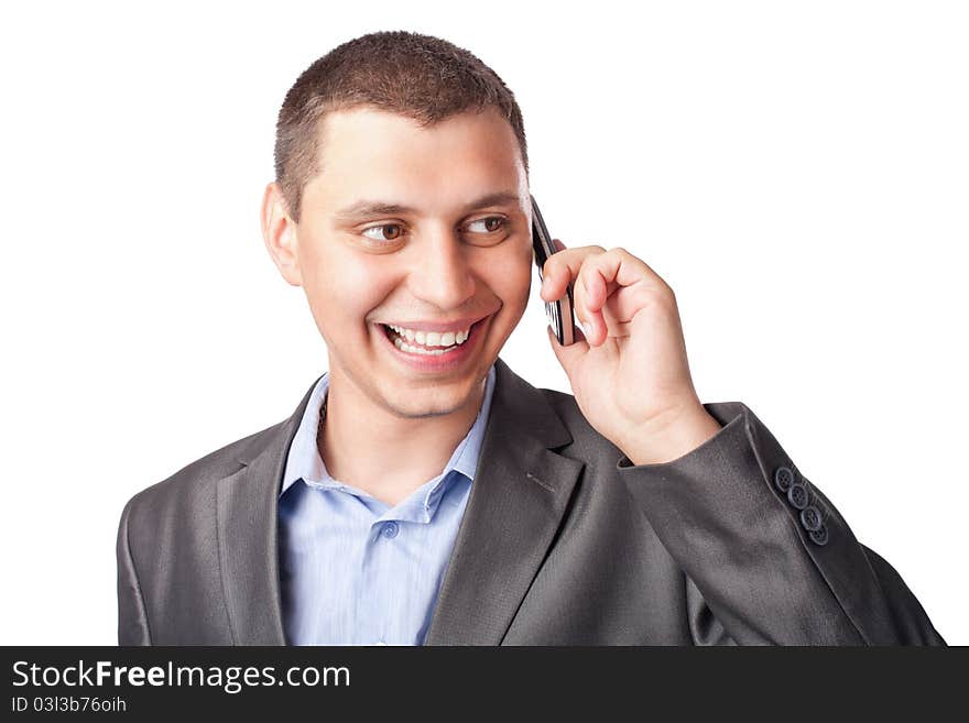 Close up portrait of smiling happy young businessman with mobile phone isolated on white background