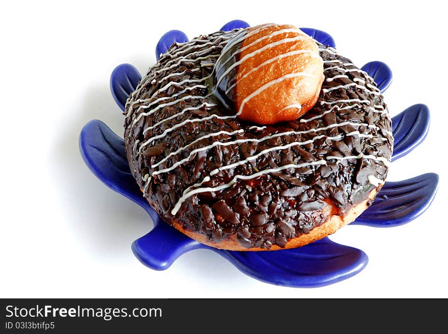 Morning Donut on Blue Leafy Plate on White Table