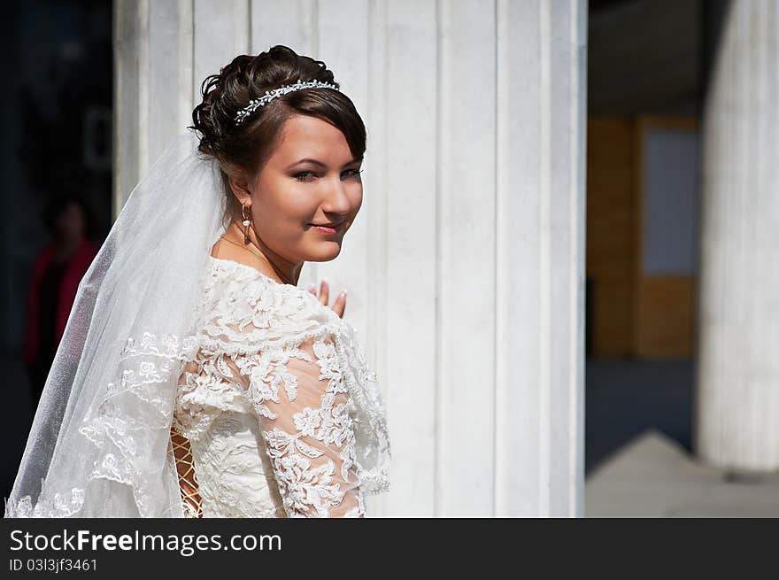 Happy Bride Near White Columns