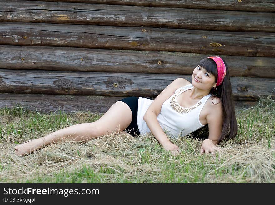 Beautiful girl sitting on hay